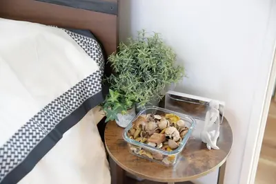 a table with a container of rocks and plants on it at Y-city house in Tokyo