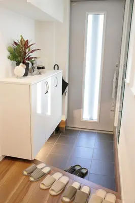 a group of slippers on the floor of a kitchen at Y-city house in Tokyo