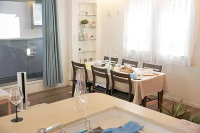 a dining room with a table and chairs at Y-city house in Tokyo