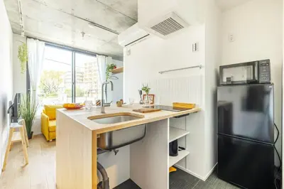 a kitchen with a sink and a refrigerator at NewOpen,\u65b0\u5bbf,\u4e2d\u91ce,SHINJUKU,NAKANO,Parkview,Art,trias234 vacation stay in Tokyo