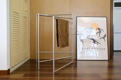 a towel rack in a room with a poster at Palaisgrace Shibuya - Live Like a Trendy Local in Sangenjaya \u4e09\u8ed2\u8336\u5c4b - Direct Shibuya Access in Tokyo