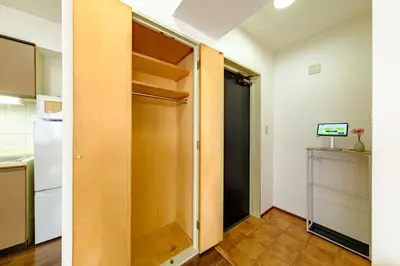a door to a kitchen with a refrigerator at Palaisgrace Shibuya - Live Like a Trendy Local in Sangenjaya \u4e09\u8ed2\u8336\u5c4b - Direct Shibuya Access in Tokyo
