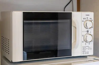 a microwave oven sitting on top of a counter at tokyo \u738b\u5b50 hotel in Tokyo