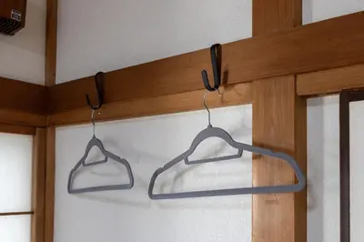 a pair of hangers hanging from a wall at tokyo \u738b\u5b50 hotel in Tokyo