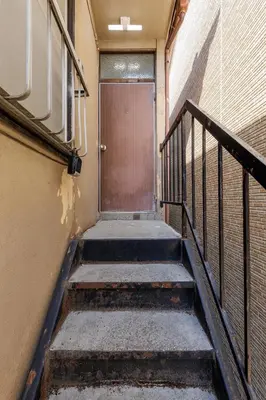a staircase leading to a door in a building at Perfect for sightseeing in Tokyo! 6 people! \u56db\u3064\u6728 in Tokyo