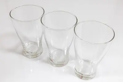 four empty wine glasses sitting on a white surface at Perfect for sightseeing in Tokyo! 6 people! \u56db\u3064\u6728 in Tokyo