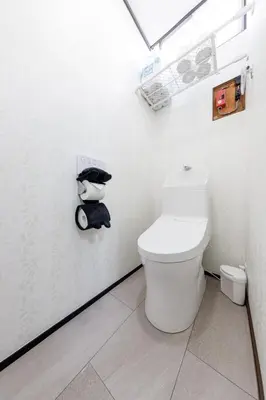 a white bathroom with a toilet in a room at Perfect for sightseeing in Tokyo! 6 people! \u56db\u3064\u6728 in Tokyo