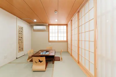 a room with a table and chairs and a window at Oshiage SAIEI Executive Apartments in Tokyo