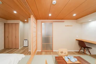 a bedroom with a bed and a desk and a table at Oshiage SAIEI Executive Apartments in Tokyo