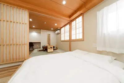 a bedroom with a large white bed in a room at Oshiage SAIEI Executive Apartments in Tokyo