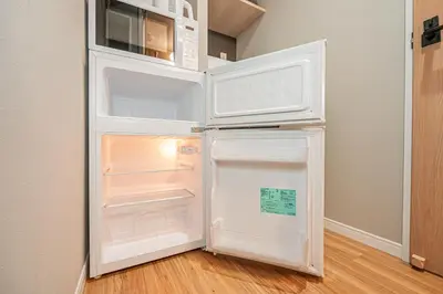 a white refrigerator with its door open in a kitchen at Komorebi Asakusa Cozy 4P Stay The 77 House Tokyo in Tokyo