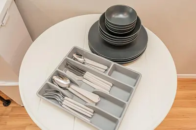 a tray with utensils and a black hat on a table at Komorebi Asakusa Cozy 4P Stay The 77 House Tokyo in Tokyo