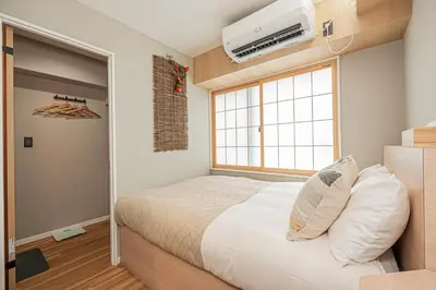 a small bedroom with a bed and a window at Komorebi Asakusa Cozy 4P Stay The 77 House Tokyo in Tokyo