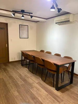 a conference room with a wooden table and chairs at \u79cb\u8449\u539f in Tokyo
