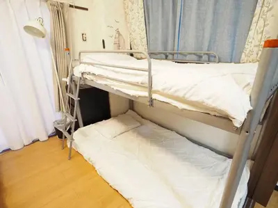 two bunk beds in a room with a window at 302Near Ueno Heart of city in Tokyo