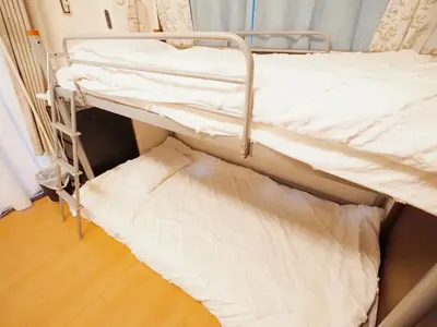 a bunk bed in a room with a bed frame and a floor at 302Near Ueno Heart of city in Tokyo