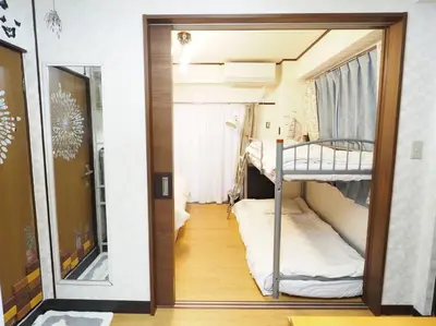 a small room with two bunk beds in it at 302Near Ueno Heart of city in Tokyo