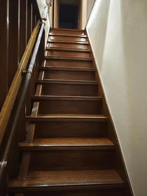 a set of wooden stairs in a building at ZYZ Sakuradai House NR0259 in Tokyo