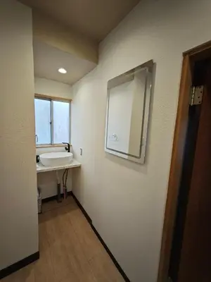 a bathroom with a sink and a mirror on the wall at ZYZ Sakuradai House NR0259 in Tokyo
