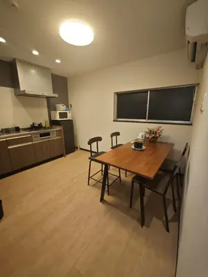a room with a table and chairs in a kitchen at ZYZ Sakuradai House NR0259 in Tokyo
