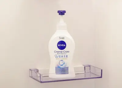 a large bottle of cleaning agent sitting on a shelf at Coco Aoto in Tokyo