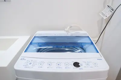 a washer and dryer sitting in a room at K'shotel Takadanobaba 山手線駅6分繁華街に近い静かな住宅街のデザイナーズホテル in Tokyo