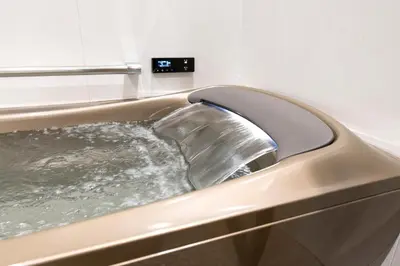 a metal tub filled with water in a bathroom at ENT TERRACE Asakusabashi in Tokyo