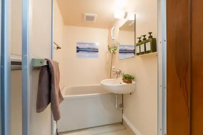 a bathroom with a sink and a bath tub at tai\u4e0a\u5317\u6ca24\u4e01\u76ee in Tokyo