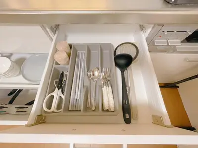 a drawer filled with utensils in a kitchen at Sakura Stay \u62bc\u4e0a in Tokyo