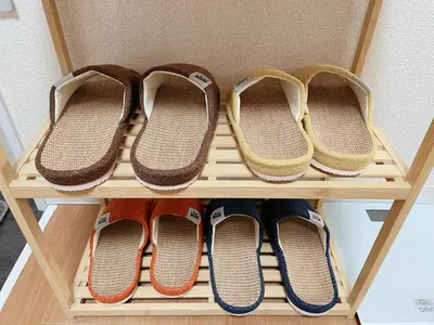 a shelf with four pairs of shoes on it at Sakura Stay \u62bc\u4e0a in Tokyo