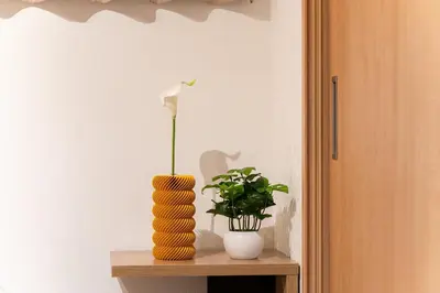 a vase on a table with a flower in it at tai\u4e21\u56fd4\u4e01\u76eeGLV\u516c\u9928701 in Tokyo
