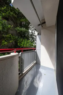a balcony with a view of a building at shibuya e adress in Tokyo