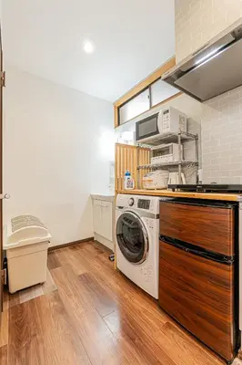a kitchen with a washing machine and a washer at Tokyo Skytree House 4LDK, 2Bath, 9 Guests, 6min to Keisei Hikifune in Tokyo