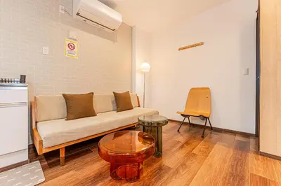 a living room with a couch and a table at Tokyo Skytree House 4LDK, 2Bath, 9 Guests, 6min to Keisei Hikifune in Tokyo