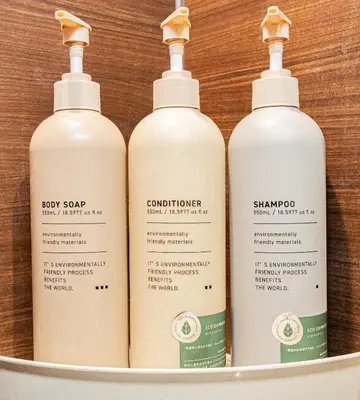 a group of four shampoo bottles in a bucket at Tokyo Skytree House 4LDK, 2Bath, 9 Guests, 6min to Keisei Hikifune in Tokyo