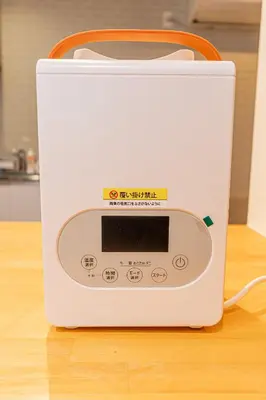 a white toaster sitting on top of a table at Tokyo Skytree House 4LDK, 2Bath, 9 Guests, 6min to Keisei Hikifune in Tokyo