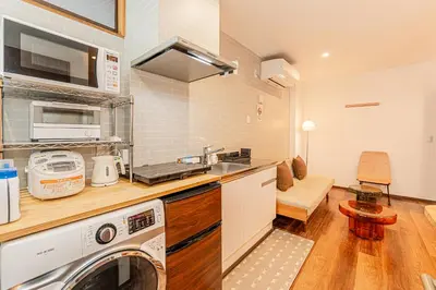 a kitchen with a washer and a washing machine at Tokyo Skytree House 4LDK, 2Bath, 9 Guests, 6min to Keisei Hikifune in Tokyo