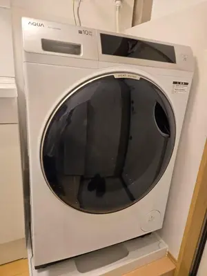 a white washing machine sitting on a shelf at Karawaru Stay \u5e73\u4e95 A in Tokyo