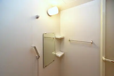 a bathroom with a mirror on the wall at Karawaru Stay \u5e73\u4e95 A in Tokyo
