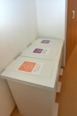 two boxes sitting on top of a toilet in a room at Karawaru Stay \u5e73\u4e95 B in Tokyo