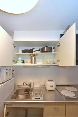 a kitchen with a sink and a counter top at Karawaru Stay \u5e73\u4e95 B in Tokyo