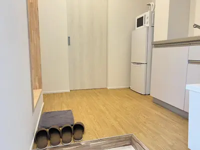 an empty room with a kitchen with a refrigerator at Ikebukuro Area 2F3 KamiikeApartment in Tokyo