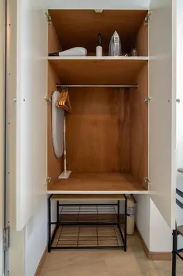 a cupboard in a kitchen with a sink at CraftFlat Komagome 605, a compact studio at excellent location in Tokyo