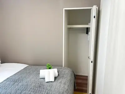 a bedroom with a bed with a potted plant on it at Ikebukuro Area 2 Units 1112 KamiikeApartment in Tokyo