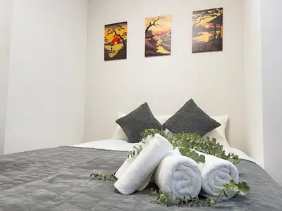 a bedroom with a bed with towels on it at Ikebukuro Area 2 Units 1112 KamiikeApartment in Tokyo