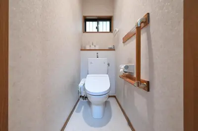 a bathroom with a white toilet in a room at Modern & Spacious Family House - 15 mins to Haneda Airport in Tokyo