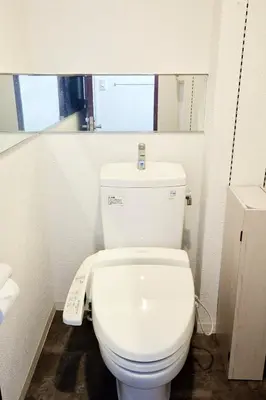 a bathroom with a white toilet with a scale at Hotel-Mercurius-Azabujuban-RB in Tokyo