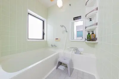 a bathroom with a tub and a toilet in it at Direct bus from Haneda 3BR House Near Station in Tokyo