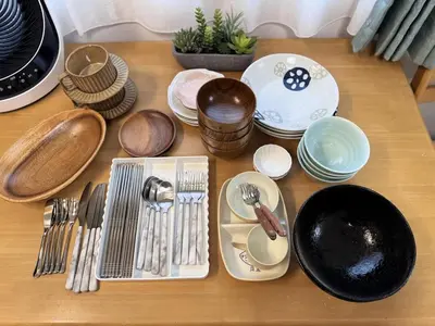 a table with plates and utensils on it at Moto Sakura for families 3 luxury beds 2bedroom apartment in a quiet and convenient location in Tokyo