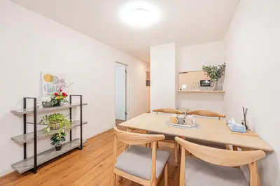 a dining room with a table and chairs at Mori house \u6839\u5cb8 401 in Tokyo